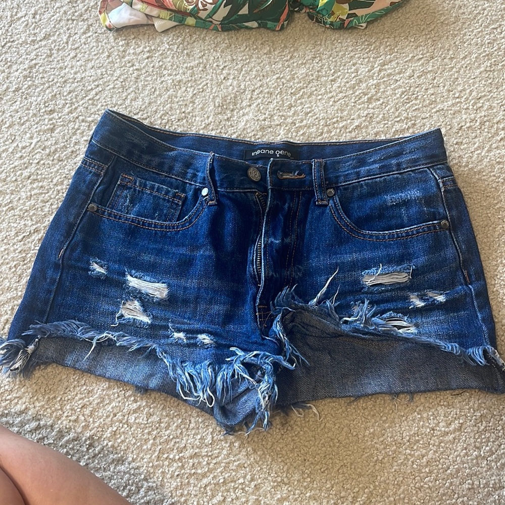 Jean shorts. Size small. Never Worn. Ripped and denim